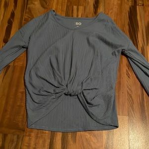 A blue nixe shirt that is cropped a little bit in the front, womens Xs, from So.